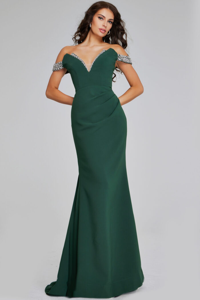 Model wearing Jovani 42394 green gown with beaded neckline from the front.