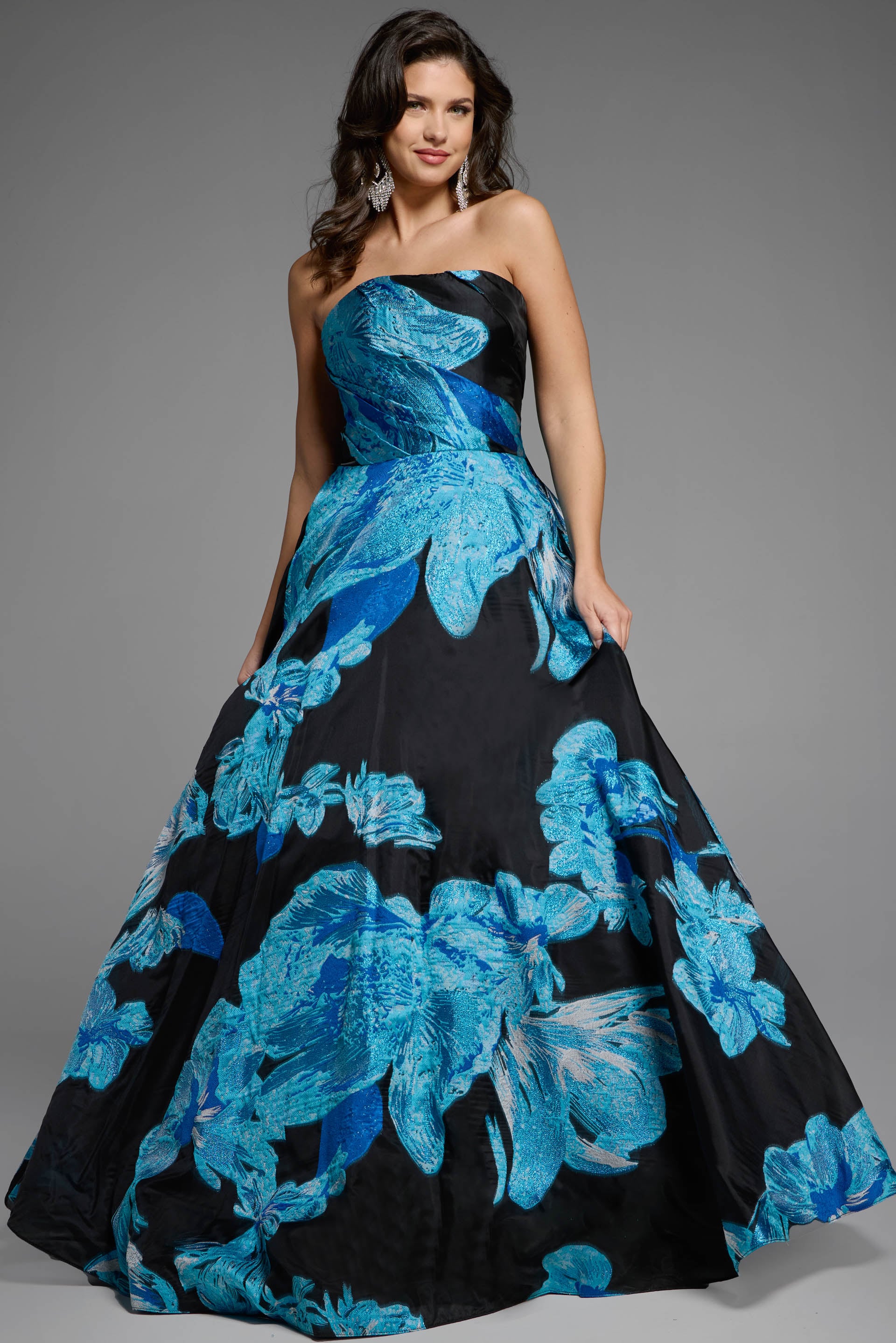 42436_BLUBLK_007 Voluminous black ball gown adorned with vivid blue floral patterns.