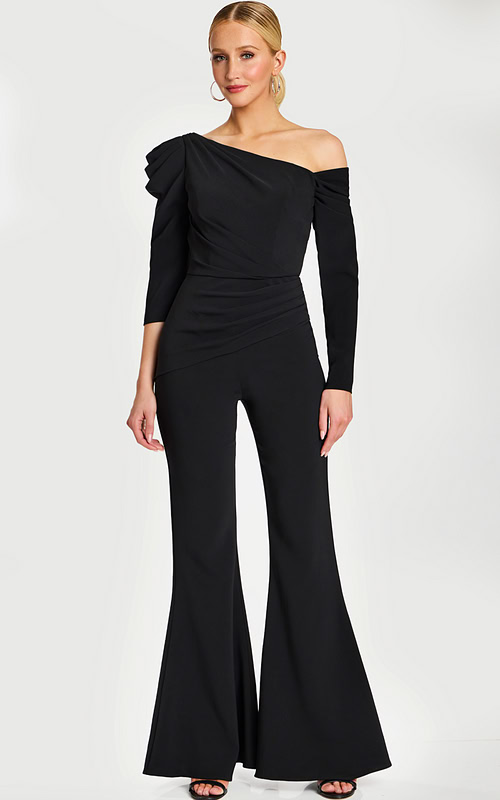 Model in fitted black jumpsuit with dramatic shoulder pleats and flare legs
