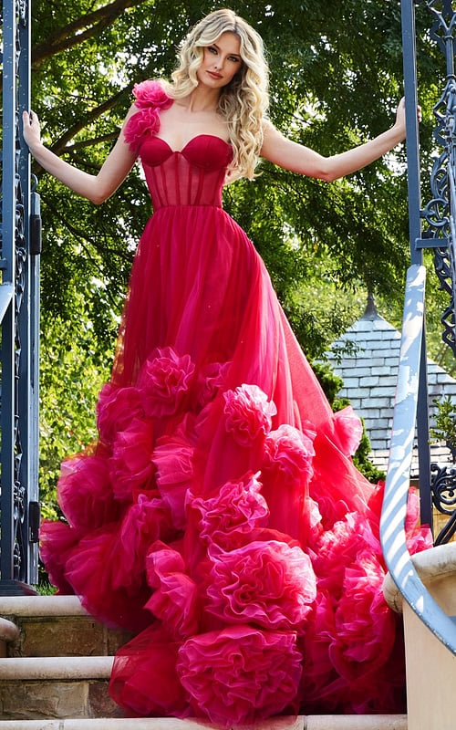 model showcasing Jovani 42781 red gown with asymmetric rosette shoulder