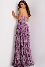 Tiered gown featuring leaf motifs and open back design