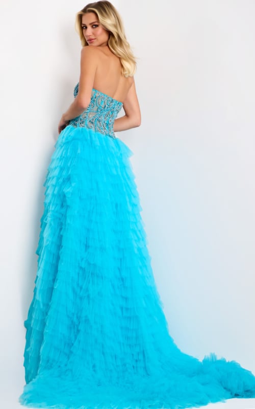 Layered tulle evening dress with high slit and extended train
