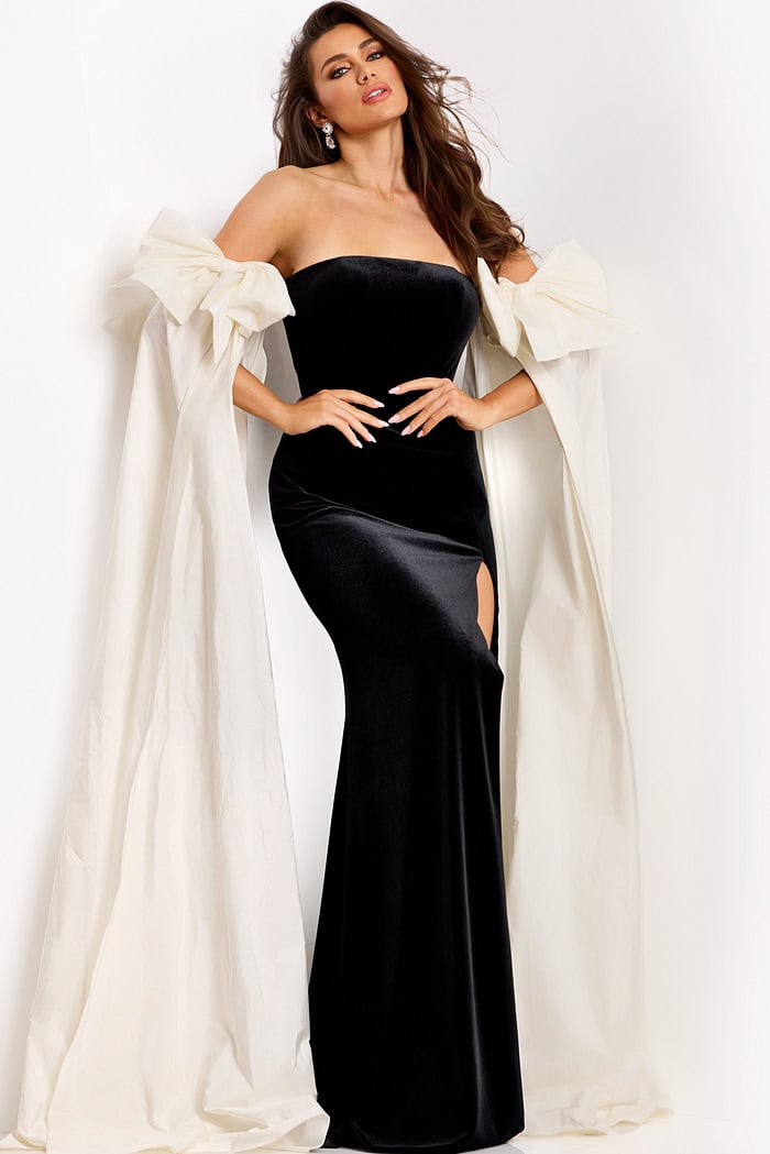 Strapless velvet gown with high slit and ivory cape