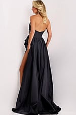 Black evening dress featuring thigh-high slit and side bow detail