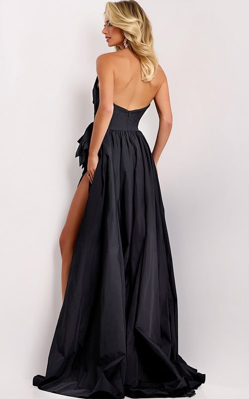 Black evening dress featuring thigh-high slit and side bow detail