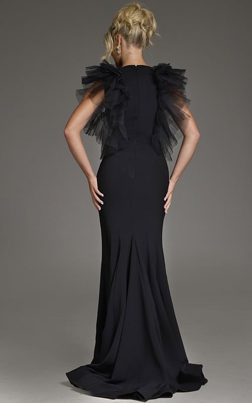 Model wearing Jovani 43153 black dress with flutter sleeves, back view.