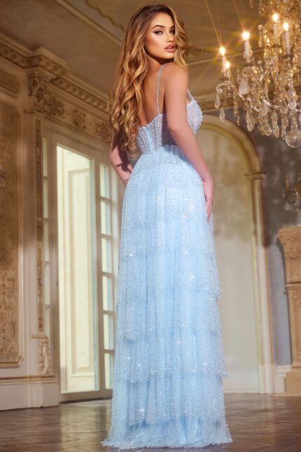 Model showcasing the back of Jovani 43193 elegant blue gown with tiered layers.