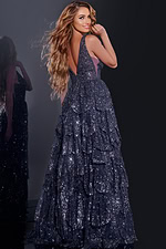 Model showcasing the back of Jovani 43198 navy blue tiered sequined gown