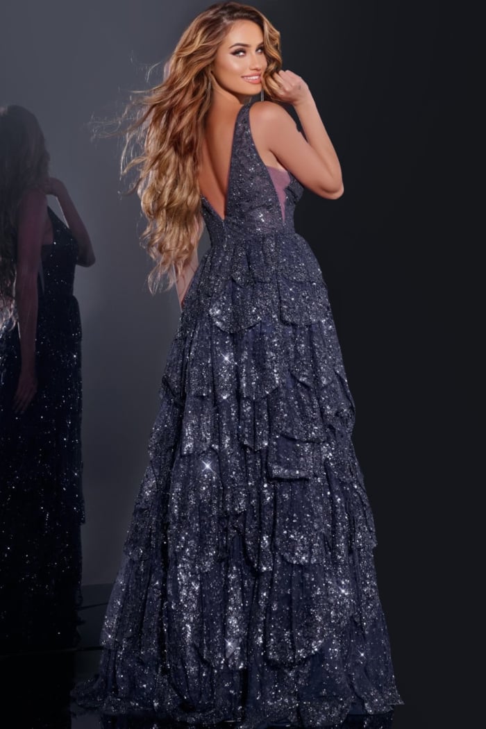 Model showcasing the back of Jovani 43198 navy blue tiered sequined gown
