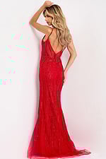 Fitted red gown with open back and sparkling beadwork