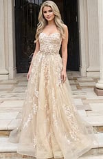 Front view of a strapless floral appliqué gown with layered tulle skirt