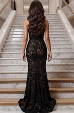 Back view of lace gown with smooth fitted shape and subtle sparkle