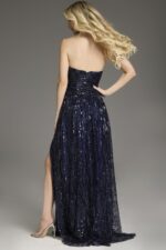Model wearing Jovani 43386 navy gown, back view