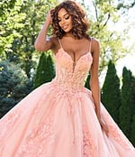 Model wearing Jovani 43431 blush gown, close-up view of bodice.