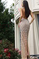 Sparkling beaded gown featuring sheer fabric and fitted silhouette