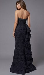 Back view of strapless ruched gown with beaded neckline detail and layered side ruffle train