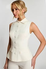 Side View Of Ivory Peplum Pant Suit With Pointed Collar And Sleek Silhouette