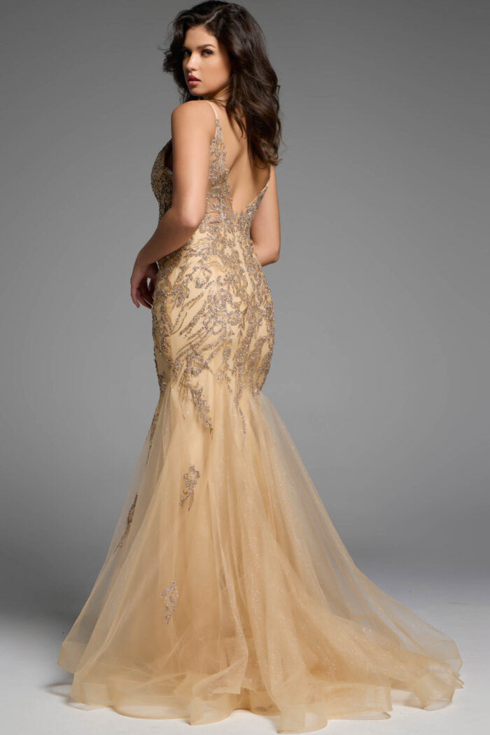 Back view of a gold mermaid dress with sequin embellishments and a flowing train.