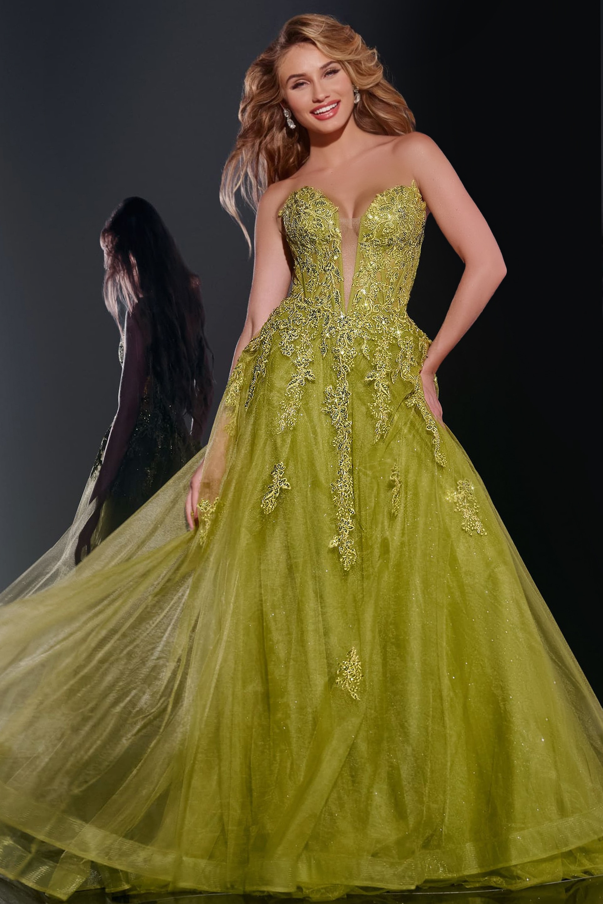 43849-1 Model wearing Jovani 43849 green ball gown with sweetheart neckline and lace appliques from the front.