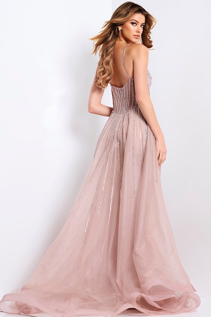 Blush pink prom gown with corset top and shimmering beaded design