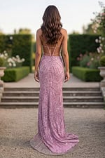 Sleek fitted gown with geometric beading, a plunging V neckline, open back, and thigh-high slit. Designed for formal evenings and special events.