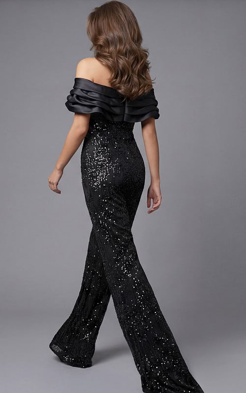 Back view of beaded wide leg jumpsuit with off shoulder draped neckline, fitted waist, and flowing pants