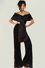 Elegant black jumpsuit featuring draped neckline and embellished pants