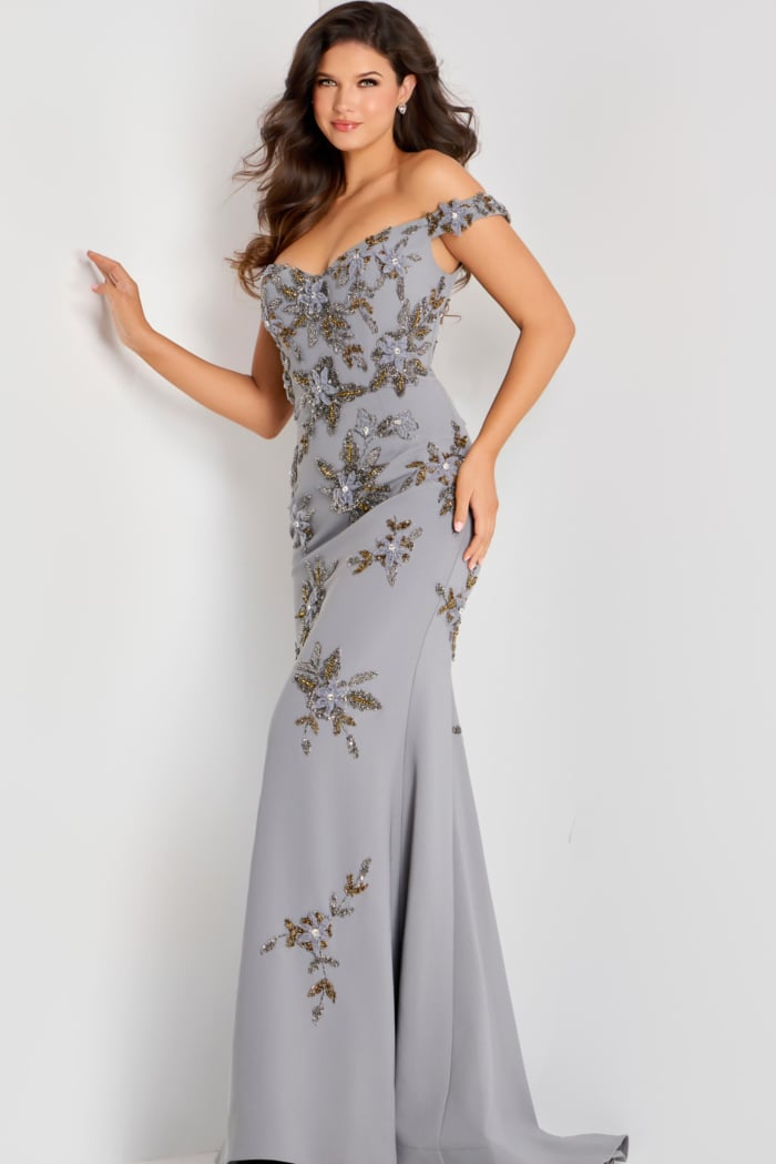 Off shoulder gown adorned with intricate gold and silver floral beadwork, fitted through the bodice and flowing into a soft mermaid silhouette.