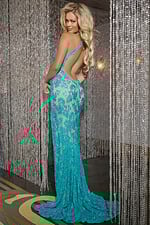 Back view of model wearing Jovani 44035 blue gown with open back design.