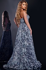 Model showing back view of Jovani 44151 navy gown with intricate embroidery.