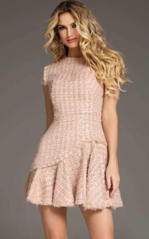 Model wearing Jovani 44192 blush short dress with high neckline and cap sleeves, front view.