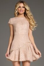 Model wearing Jovani 44192 blush short dress with high neckline and cap sleeves, alternate front view.