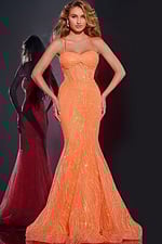 Model wearing Jovani 44208 orange gown with sweetheart neckline and mermaid silhouette.