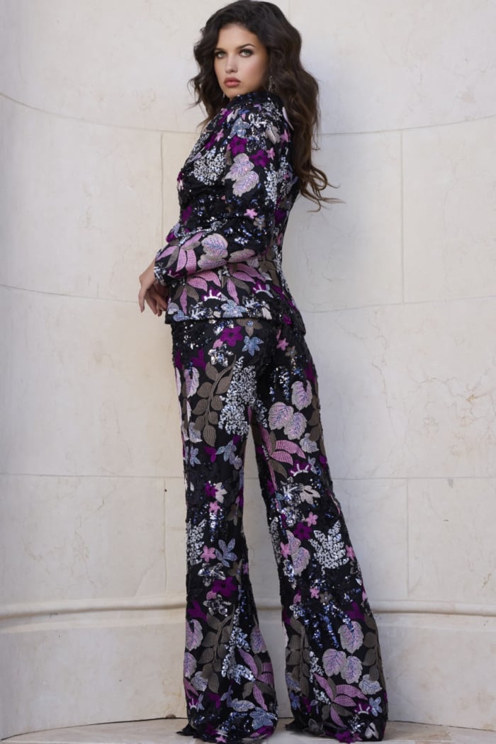 Back view of Jovani 44224 showing the vibrant floral pattern and fit of the jacket and matching pants.
