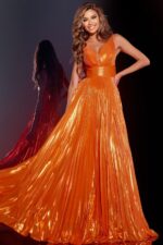 model wearing 44230 orange gown with flowing skirt and V-neckline
