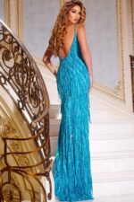 Model wearing Jovani 44273 blue dress with deep plunge back view