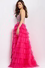 Bright pink strapless tiered prom dress with sparkle bodice