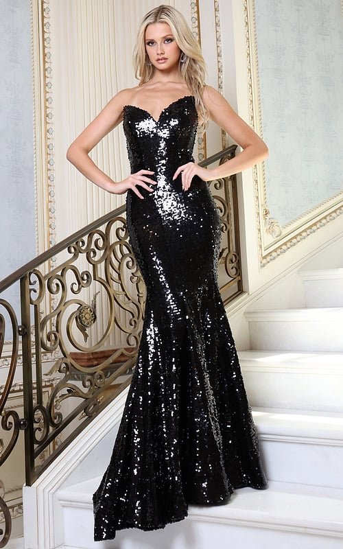 black strapless sequin mermaid prom dress - front full body, hands on hips grand staircase