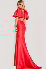 Elegant satin gown featuring dramatic puff sleeves, open back with bow detail, and floor-length mermaid skirt.