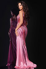 Model wearing Jovani 44577 fuchsia gown, back view highlighting fit and flare design.