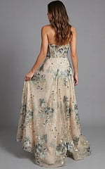Back view of strapless evening gown with structured corset detailing and flowing skirt