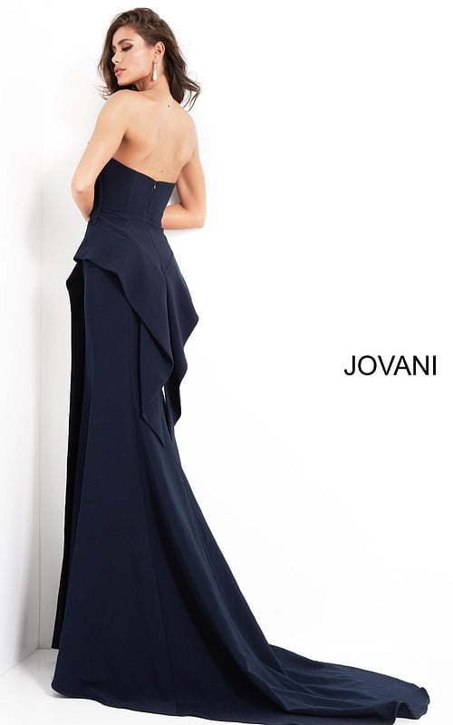 Back view of model wearing Jovani 4466 navy dress showcasing cascading ruffle details.