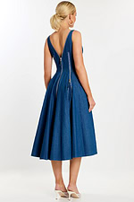 Back view of denim dress with V-shaped back and vertical zipper details