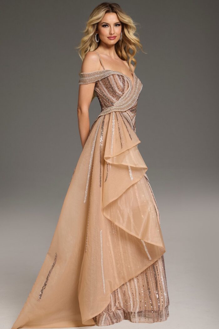 Model wearing Jovani 44843 in an elegant beige dress with beadwork and a slight flare.
