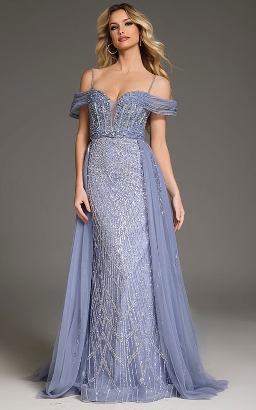 Model wearing Jovani 44845 blue gown with intricate beading and off-the-shoulder neckline.