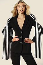 Elegant women’s tailored suit featuring statement striped accents