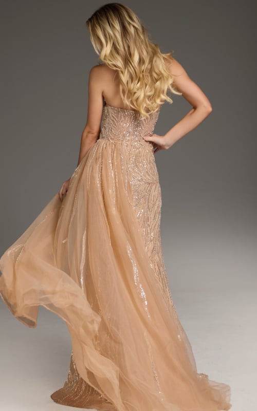 Back view of Jovani 45071 beige gown with flowing skirt