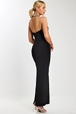 Back view of the black evening gown showing the strapless back and slim silhouette