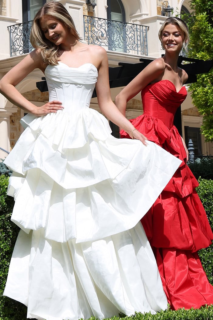 strapless layered ruffle ball gown - two girls front, smiling, tiered skirts
