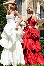 strapless layered ruffle ball gown - two girls front, contrasting vibrant gowns, expressive poses